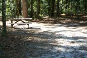 This site includes water, septic, and electric.  Accommodates tents, pop ups and RV's without slide outs or awnings.