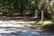 This site includes water, septic, and electric.  Accommodates tents, pop ups and RV's without slide outs or awnings.
