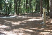This site includes water, septic, and electric.  Accommodates tents, pop ups and RV's without slide outs or awnings.