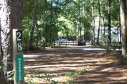 This site is a pull through and includes water, septic, and electric.  Accommodates tents, pop ups and RV's.
