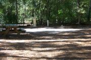This site is a pull through and includes water, septic, and electric.  Accommodates tents, pop ups and RV's.