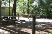 This site is a pull through and includes water, septic, and electric.  Accommodates tents, pop ups and RV's.