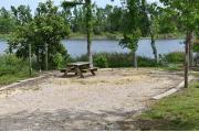 View of lake from campsite with picnic table.