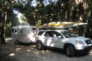 Campers are working to set up their site for the weekend in the campground at Tomoka State Park. They came prepared with a small travel trailer and two kayaks for exploring the rivers and creeks which are accessible from the boat ramp in Tomoka State Park.