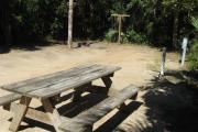 Each site is equipped with a picnic table, lantern post, hose bib, electric hook-up for 20 and 50 amp service, and fire pit on the ground with a fold over grill top.
