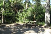 Each site is equipped with a picnic table, lantern post, hose bib, electric hook-up for 20 and 30 amp service, and fire pit on the ground with a fold over grill top.