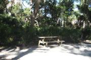 Each site is equipped with a picnic table, lantern post, hose bib, electric hook-up for 20 and 30 amp service, and fire pit on the ground with a fold over grill top.