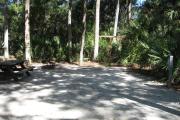 Each site is equipped with a picnic table, lantern post, hose bib, electric hook-up for 20 and 30 amp service, and fire pit on the ground with a fold over grill top.