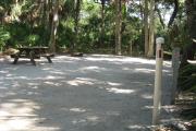 Each site is equipped with a picnic table, lantern post, hose bib, electric hook-up for 20 and 30 amp service, and fire pit on the ground with a fold over grill top.
