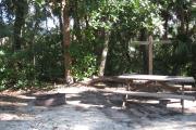 Each site is equipped with a picnic table, lantern post, hose bib, electric hook-up for 20 and 30 amp service, and fire pit on the ground with a fold over grill top.