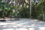 Each site is equipped with a picnic table, lantern post, hose bib, electric hook-up for 20 and 30 amp service, and fire pit on the ground with a fold over grill top.