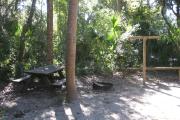 Each site is equipped with a picnic table, lantern post, hose bib, electric hook-up for 20 and 30 amp service, and fire pit on the ground with a fold over grill top.
