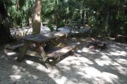 Each site is equipped with a picnic table, lantern post, hose bib, electric hook-up for 20 and 30 amp service, and fire pit on the ground with a fold over grill top.