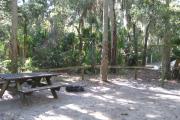 Each site is equipped with a picnic table, lantern post, hose bib, electric hook-up for 20 and 30 amp service, and fire pit on the ground with a fold over grill top.