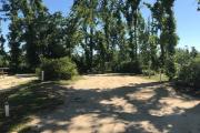 Full view of campsite 4 from road. Electrical and water hookup are located on the right side of site (not shown).