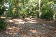 Full view of campsite 5 from road. Electrical hookup is located on the right side and water hook up is located on the left side of site