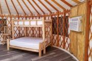 View of the YURT deck with a covered preparation station and a picnic table.