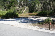In LOOP 1 #5, a better view of the entrance to the site more palmetto and trees surround the site. Site Marker is on the right side of the main road