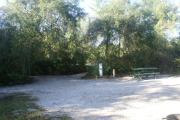 Campsite #20 at Blue Spring State Park showing picnic table, electric hook up and water spigot.