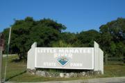 Entrance sign at front gate welcoming visitors into Little Manatee River State Park.