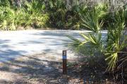 Looking at campsite marker #3; site is partially shaded in morning; site is paved