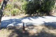 Looking at campsite marker #5; site is mostly sunny in the morning; site is paved