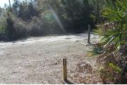 Looking at campsite marker#26; site is mixture of grass and sand