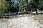 This 67 foot pull through site has a wooden picnic table and a fire ring/grill. It also has electrical and water spigot connections. Site number 15 is directly across the road of our parks newest playground.