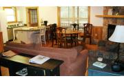 This picture shows the kitchen, living/dining room and fire place area. The two bedrooms are to the back of the picture taker and are similar to the two bedrooms in the other cabins. This cabin is closest to the Suwannee River and the parks canoe launch.