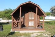 Photo: 007, PRIM. Cabin #7 at Oleta River has a porch swing, a barbeque grill and a picnic table.