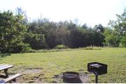 Photo: 007, PRIM. Cabin #7 at Oleta River has a fire ring, a barbeque grill and a picnic table.
