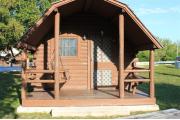 Photo: 009, PRIM. Cabin #9 at Oleta River has a porch swing and a picnic table.