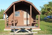 Photo: 010, PRIM. Cabin #10 at Oleta River has a porch swing and a picnic table.
