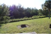 Photo: 010, PRIM. Cabin #10 at Oleta River has a fire ring, a barbeque grill and a picnic table.