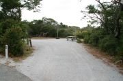 Pull through campsite with picnic table, fire ring and clothes lines poles.