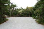 Wide campsite with picnic table.