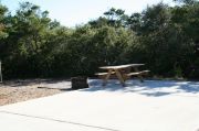 ADA-Accessible site with concrete pad, picnic table, fire ring and hook ups for water and electricity. RVs only. ADA-Accessible site with concrete pad, picnic table, fire ring and hook ups for water and electricity. RVs only.