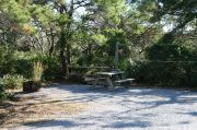 Picnic table with clothesline in campsite.