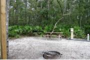 This site has a standing grill, fire ring, picnic table, water, and electric 20/30/50 amp. Amenities include a camp store, recreation hall, ADA accessible showers and restrooms, laundry, dump station, canoe rentals, short walk to the river, and playground. This is a tent only site with a fine gravel surface. There is no vehicle parking on this site.