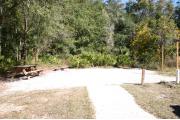 This site has a standing grill, fire ring, picnic table, water, and electric 20/30/50 amp. Amenities include a camp store, recreation hall, ADA accessible showers and restrooms, laundry, dump station, canoe rentals, short walk to the river, and playground. This is a tent only site with a fine gravel surface. There is no vehicle parking on this site.