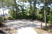 This site has a standing grill, fire ring, picnic table, water, and electric 20/30/50 amp. Amenities include a camp store, recreation hall, ADA accessible showers and restrooms, laundry, dump station, canoe rentals, short walk to the river, and playground. This is a tent only site with a fine gravel surface. There is no vehicle parking on this site.
