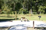 This site has a standing grill, fire ring, picnic table, water, and electric 20/30/50 amp. Amenities include a camp store, recreation hall, ADA accessible showers and restrooms, laundry, dump station, canoe rentals, short walk to the river, and playground. This is a tent only site with a fine gravel surface. There is no vehicle parking on this site.