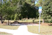 This site has a standing grill, fire ring, picnic table, water, and electric 20/30/50 amp. Amenities include a camp store, recreation hall, ADA accessible showers and restrooms, laundry, dump station, canoe rentals, short walk to the river, and playground. This is a tent only site with a fine gravel surface. There is no vehicle parking on this site.