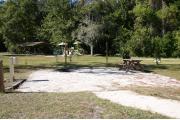 This site has a standing grill, fire ring, picnic table, water, and electric 20/30/50 amp. Amenities include a camp store, recreation hall, ADA accessible showers and restrooms, laundry, dump station, canoe rentals, short walk to the river, and playground. This is a tent only site with a fine gravel surface. There is no vehicle parking on this site.