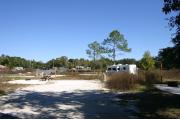 This site has a standing grill, fire ring, picnic table, water, electric 20/30/50 amp, and sewer. Amenities include a camp store, recreation hall, ADA accessible showers and restrooms, laundry, dump station, canoe rentals, short walk to the river, and playground. Tents and RV (maximum length of 40 ft) are allowed. This site is fine gravel surface.