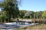 This site has a standing grill, fire ring, picnic table, water, electric 20/30/50 amp, and sewer. Amenities include a campground store, recreation hall, ADA accessible showers and restrooms, laundry, dump station, canoe rentals, short walk to the river, and playground. Maximum RV length is 40 ft. This is a paved ADA accessible site.