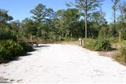 This site has a standing grill, fire ring, picnic table, water, electric 20/30/50 amp, and sewer. Amenities include a camp store, recreation hall, ADA accessible showers and restrooms, laundry, dump station, canoe rentals, short walk to the river, and playground. Tents and RV (maximum length of 40 ft) are allowed. This site is fine gravel surface.