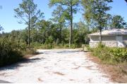 This site has a standing grill, fire ring, picnic table, water, electric 20/30/50 amp, and sewer. Amenities include a camp store, recreation hall, ADA accessible showers and restrooms, laundry, dump station, canoe rentals, short walk to the river, and playground. Tents and RV (maximum length of 40 ft) are allowed. This site is fine gravel surface.