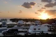 Photo: CURRY HAMMOCK SP. A colorful sun sets behind the campground at Curry Hammock State Park