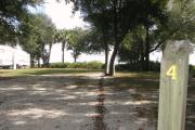 Campsite 4 is mostly shaded and has a wide vehicle pad and entrance.